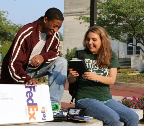 students opening care packages